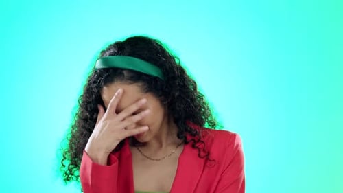 Nervous, embarrassed and hide with face of woman in studio for surprise, why and confused