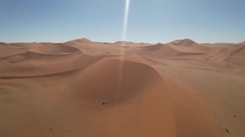 Aerial video of Deadvlei white clay pan surrounded by sand dunes, Namibia, Africa