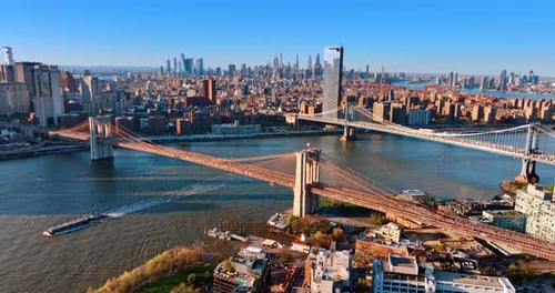 Bridges over the East River in New York. Beautiful cityscape of metropolis from aerial perspective.
