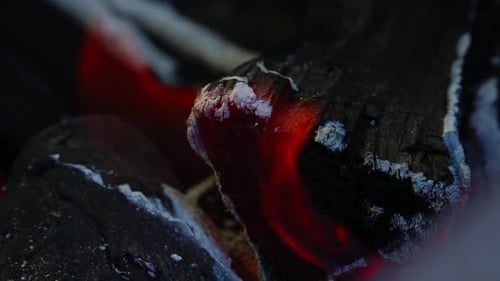 Burning Coals in Dark: Close-Up of Red Embers