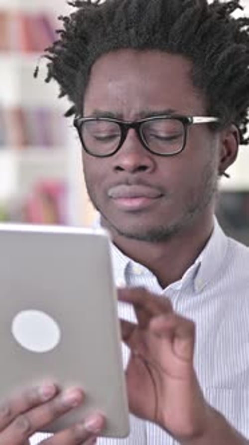 Man Uses Tablet Device Indoors