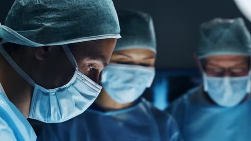 Three Medical Professionals Working Together in Surgery