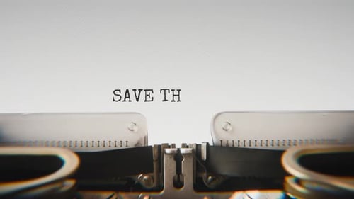 Old mechanical typewriter typing Save The Planetpollution in a close-up view.