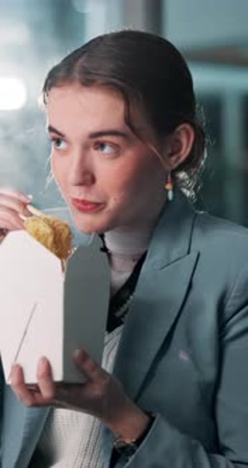 Happy woman, night or eating with noodles for break, rest or meal time at office desk