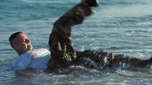Soldier Does Crunch Abs on the Beach