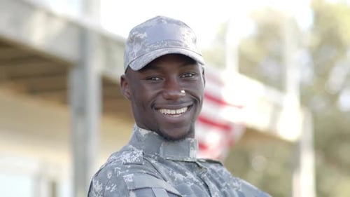 Smiling Military Man Wearing Camouflage Uniform and Hat