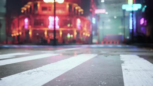 A Vibrant City Street Illuminated By the Lights of the Night
