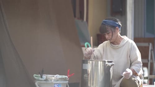 woman dyeing indigo