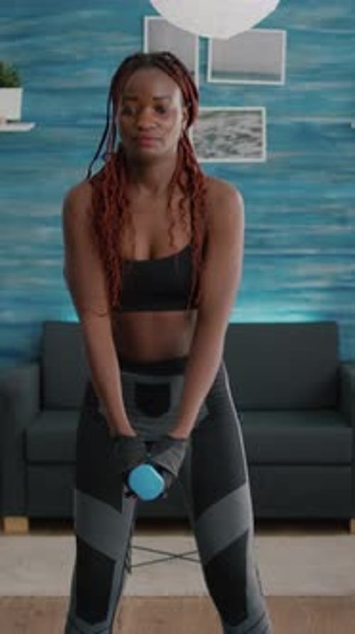 Woman Squats with Dumbbell for Fitness Training