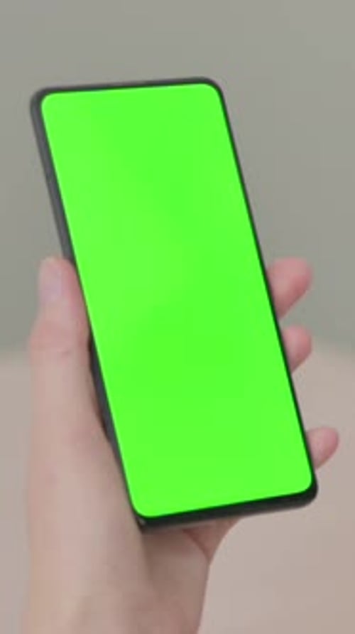 Close up of Young Woman using Smartphone with Green Screen, Vertical Video