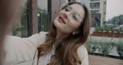 Woman Posing for Selfie in Urban Setting