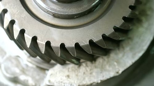 Close Up of a Spinning Metal Gear Stopping