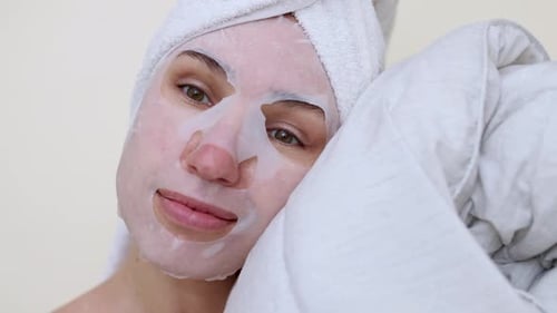 Woman With Face Mask Relaxing at Home