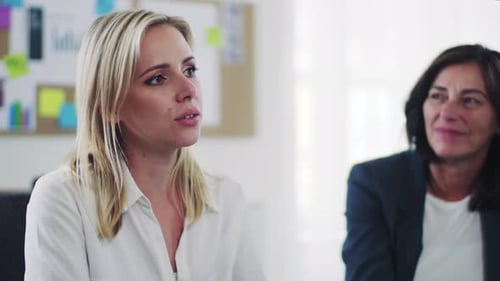 Diverse business team collaborating on plans in a modern office space