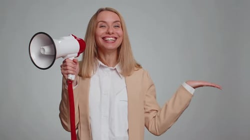 Woman Talking with Megaphone Proclaiming News Loudly Announcing Advertisement Pointing Empty Place