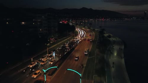 Coastal City Road with Nighttime Traffic