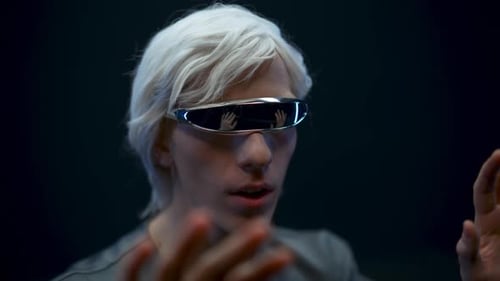 Man with Futuristic Glasses Using Virtual Interface