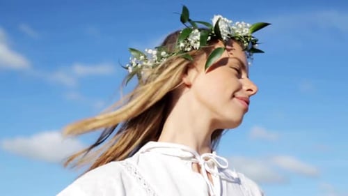 Smiling Woman with Flower Crown Enjoying Sunny Day