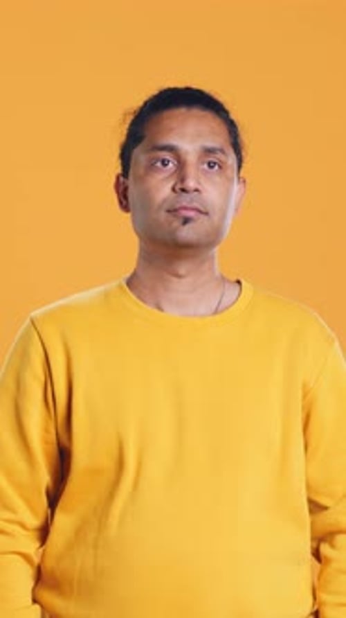 Portrait of Cheerful Friendly Man Smiling Studio Background