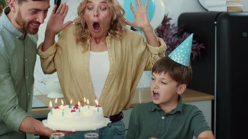 Family Celebrates Birthday at Home with Cake