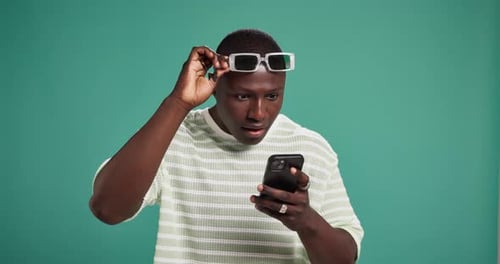 Surprise, winner and phone with black man and glasses for casino, success and competition profit