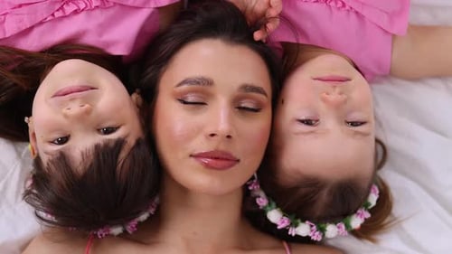 Woman and Two Girls Lying Together, Portrait