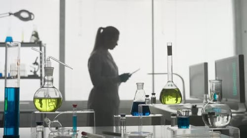 Laboratory of Modern Medical Research A Female Researcher Uses a Tablet in a Laboratory A Woman