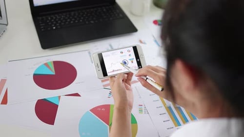 Office White Collar Worker Is Analyzing Financial Statements And Data Charts