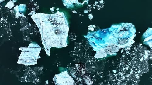 Iceberg in the Ocean Huge Chunks of Blue Glacier Ice Floating on the Waves Arctic Nature in Iceland