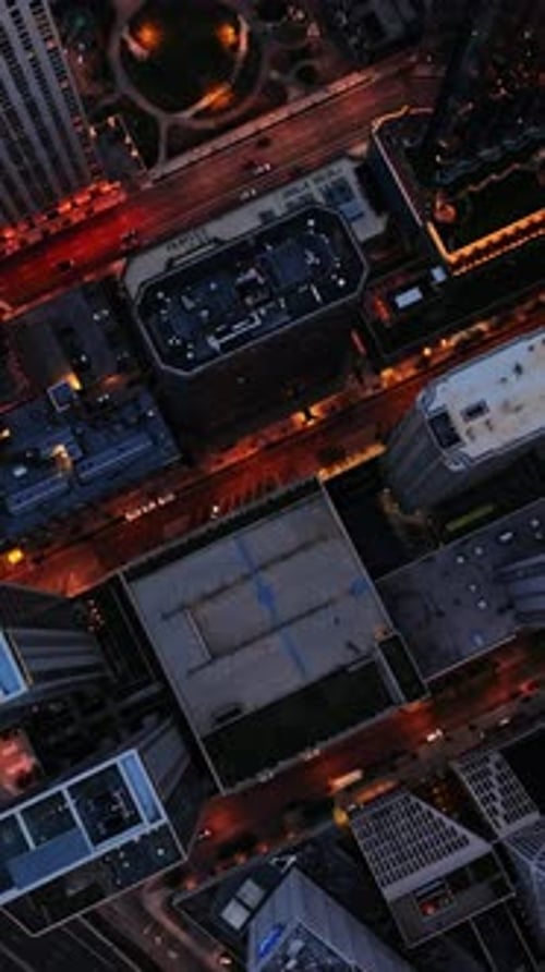 Aerial view of Chicago rooftops and roads at twilight