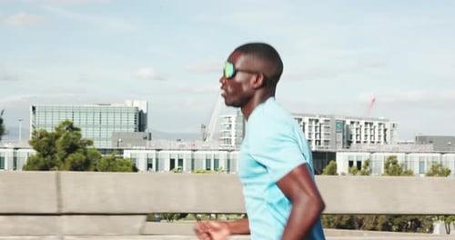 Training, running and black man in city for cardio, workout and fitness for endurance marathon