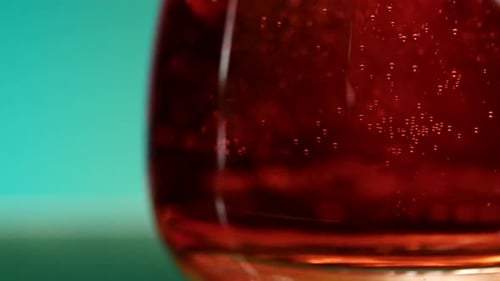 Close Up Red Bubbly Drink in Glass
