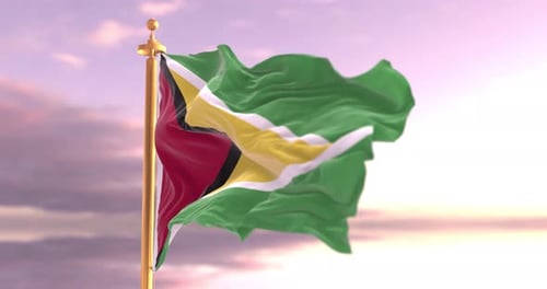 Waving Flag of Guyana Against a Cloudy Sky