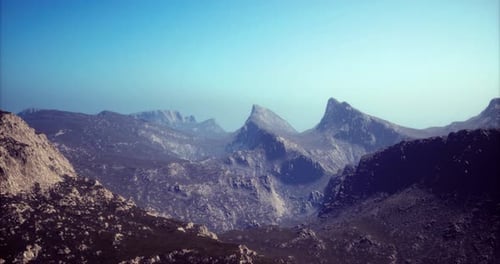 Majestic Mountain Landscape with Clear Skies and Distant Peaks in Daylight