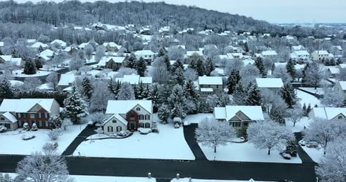 Aerial of Snow-Covered Houses in a Suburban Winter