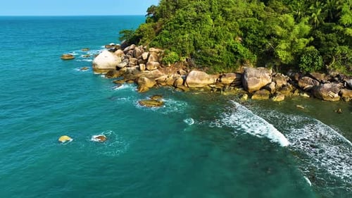 Sea waves breaking over rocks. Amazing tropical sea wave.