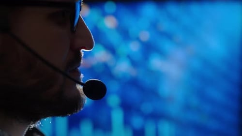 Trader is Working with Multiple Computer Screens with Charts and Data Analysis and Stock Broker