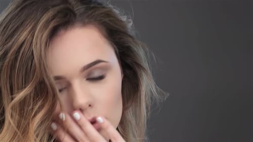 Glamorous Woman Touching Face with Elegant Hand