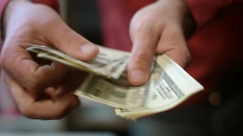 Businessman Calculate Money Income. Close Up Of Busness Man Hands Counting Money Cash. Male Hands...