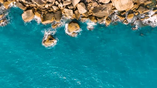 Blue ocean. Aerial view of waves and clifs.