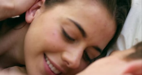 Couple, bed and kissing in with romance, affection and lust or love in an intimate moment