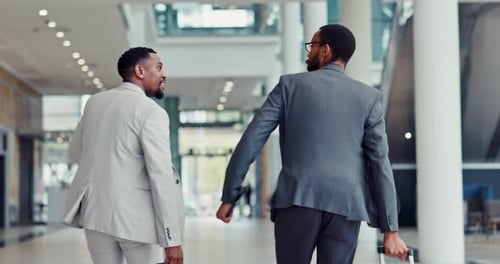 Late, running and men at airport with luggage, conversation and stress for international trip