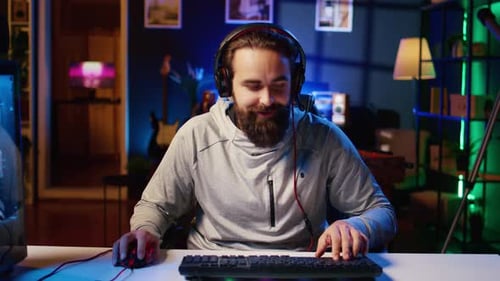 Excited Man Playing Video Games in Bedroom