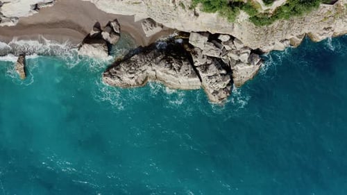 Drone Shot Highlighting Sea Coast Erosion caused by constant wave impact. Top Down Aerial View of