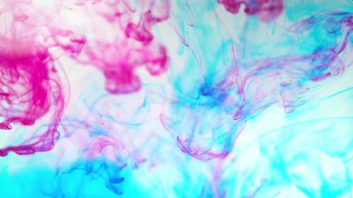 Turquoise and Fuchsia Ink Swirling Abstractly