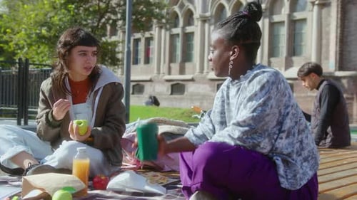 Female Students Talking on Outdoor Campus Picnic