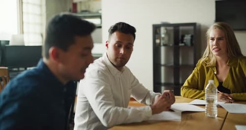 Business Team Meeting Collaborating at Office Table