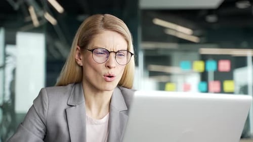 Stressed Woman Pulls Hair in Workplace