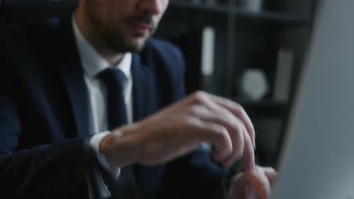 Overworked Businessman Suffering from Migraine at Office Workplace