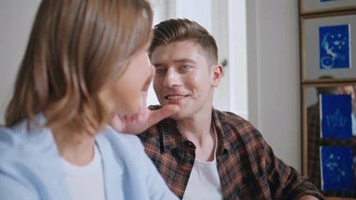 Happy Couple Talking and Smiling at Home